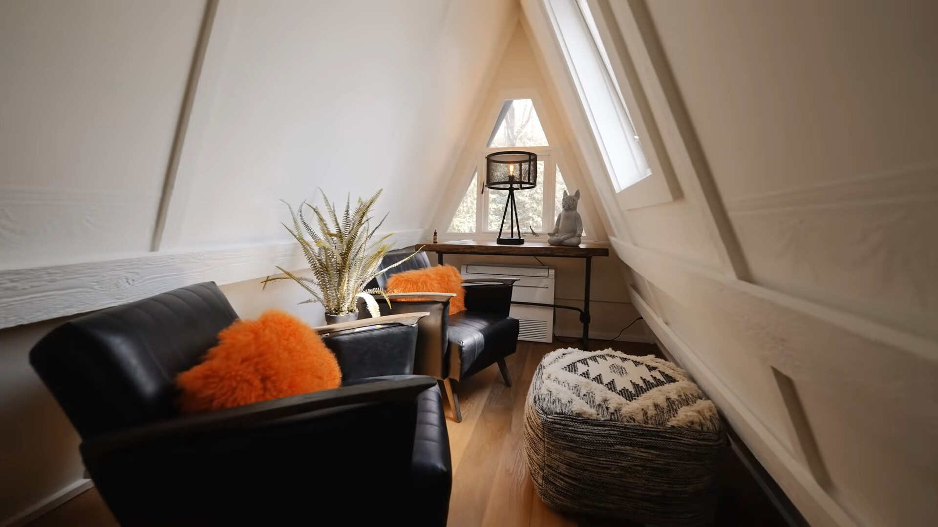 loft nook area with two leather chairs and a brown desk