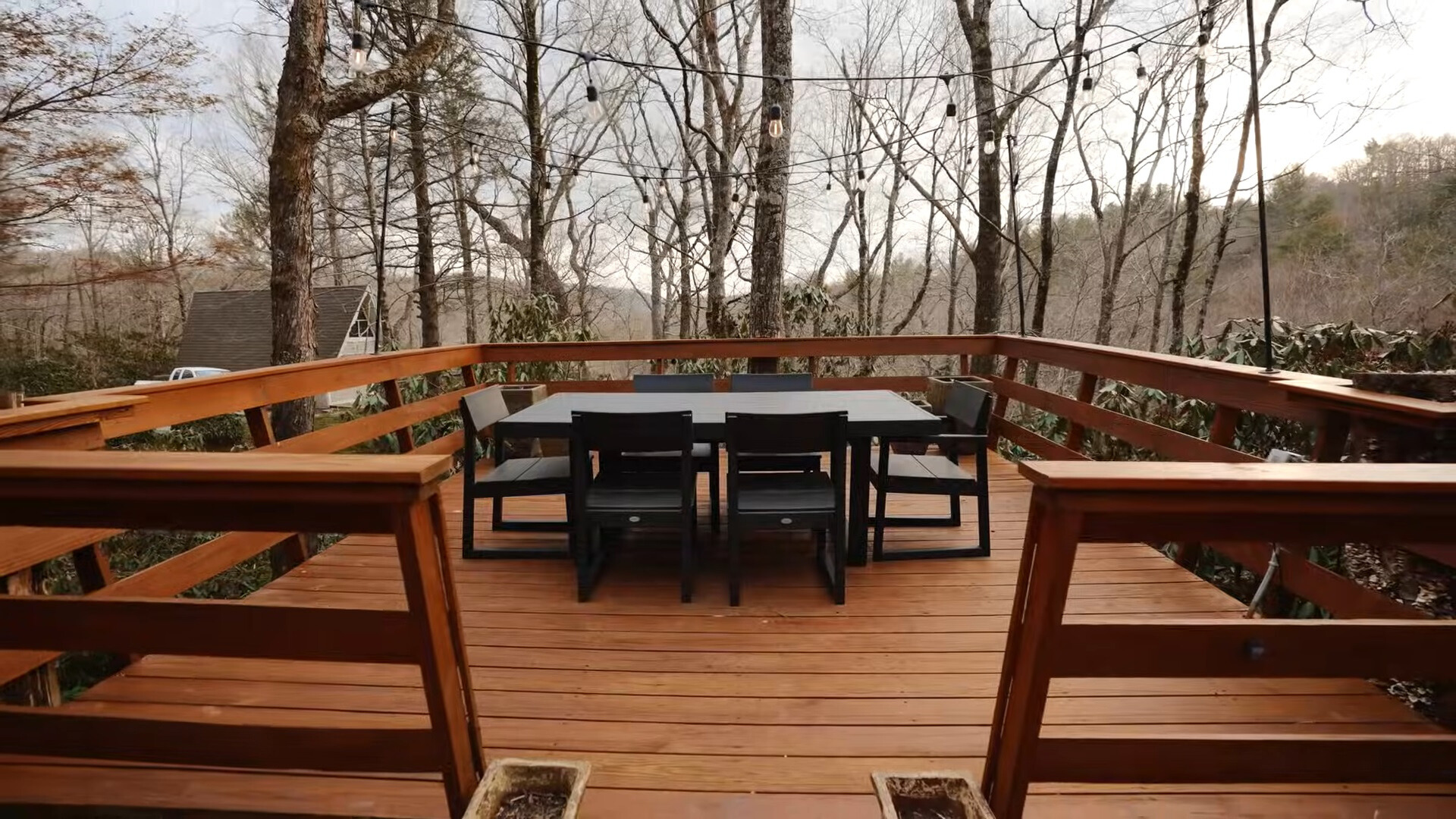 outdoors black dining table and black chairs