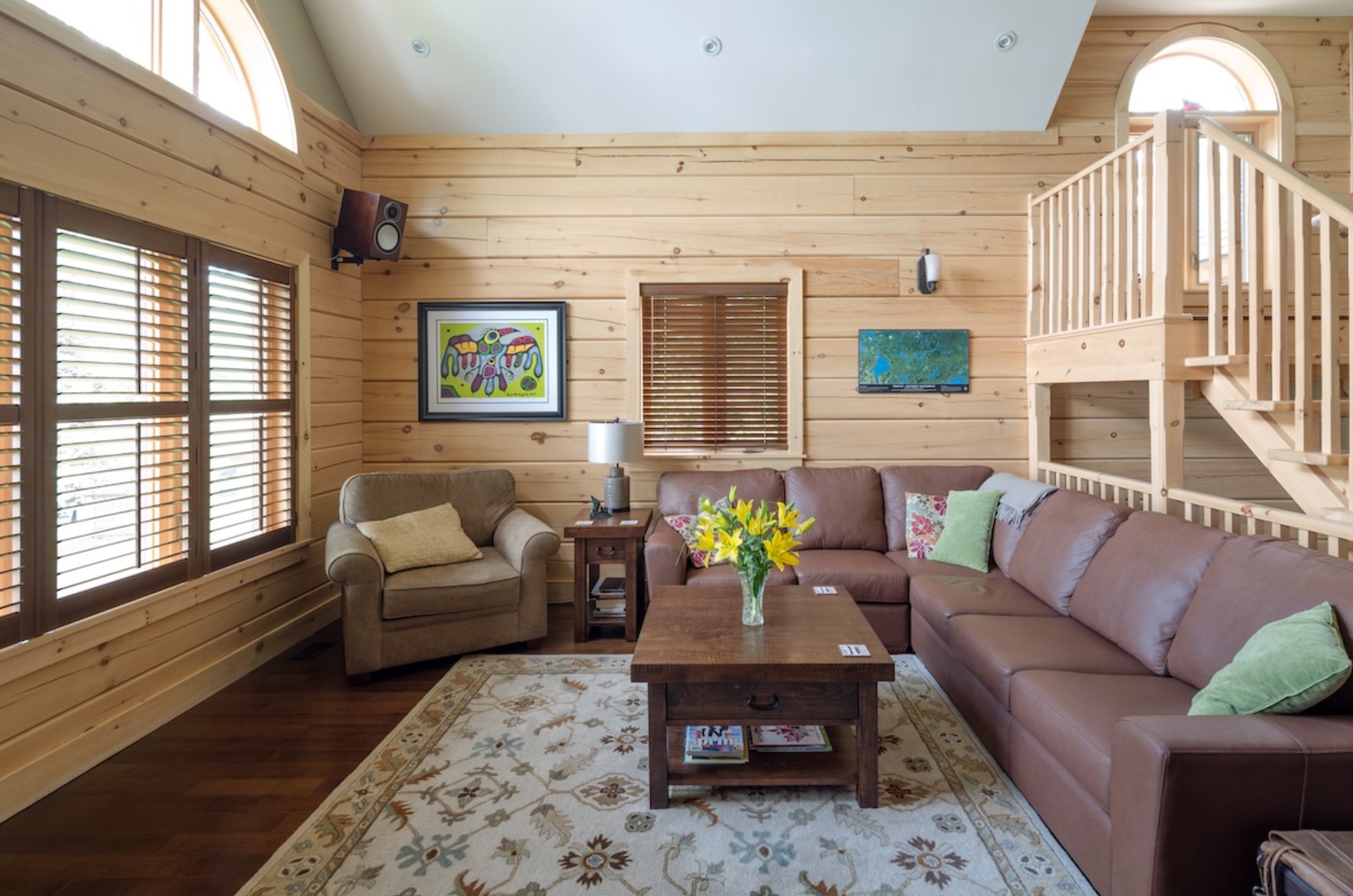 Simple living room with leather couch and a wooden coffee table