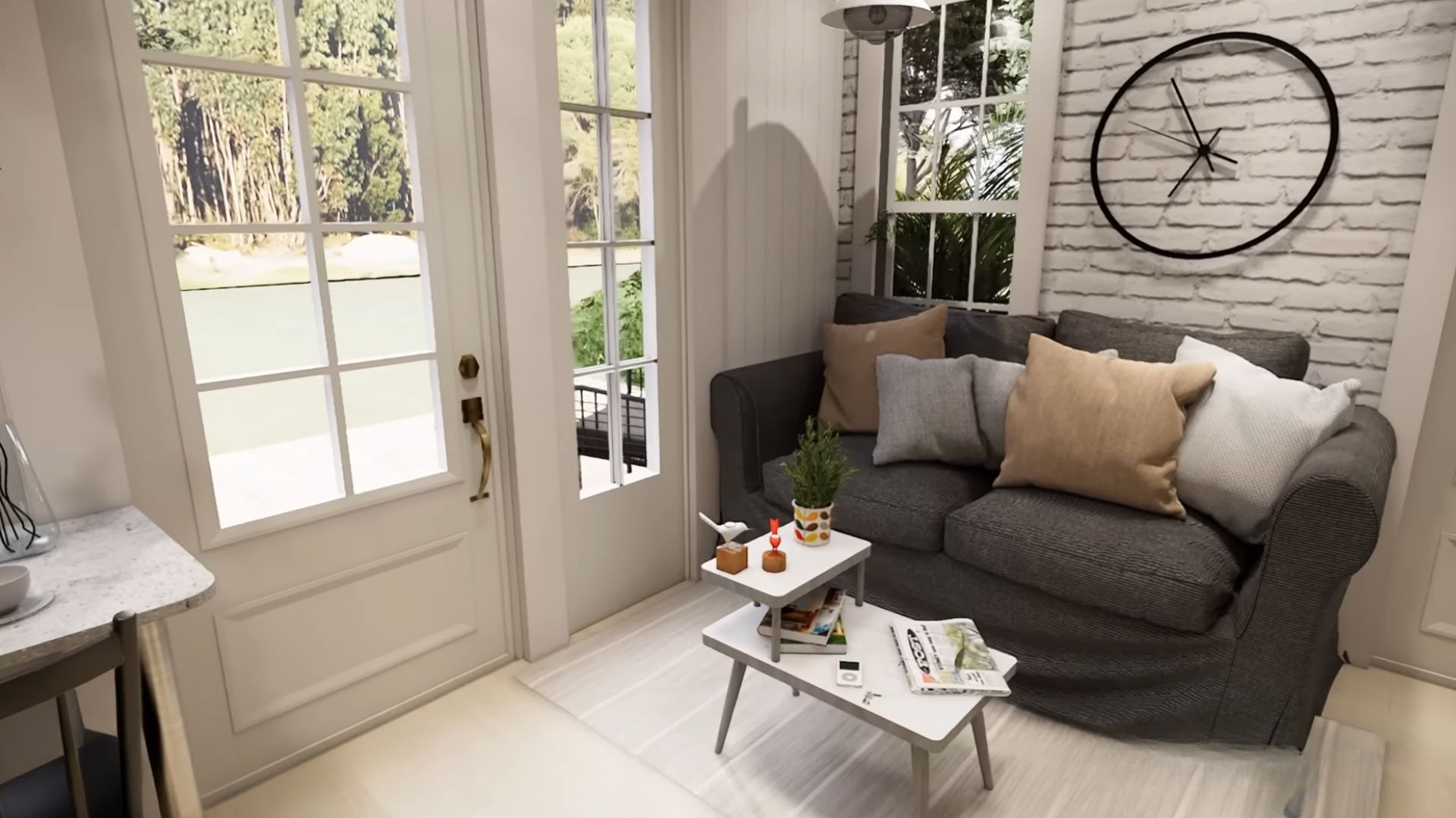 small living room area with a grey loveseat and a tiny coffee table, white exposed brick wall, a big round clock on the wall too