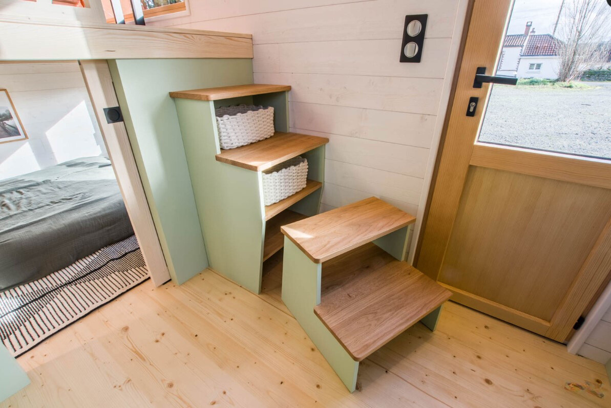 stairs to the loft which hide extra storage space