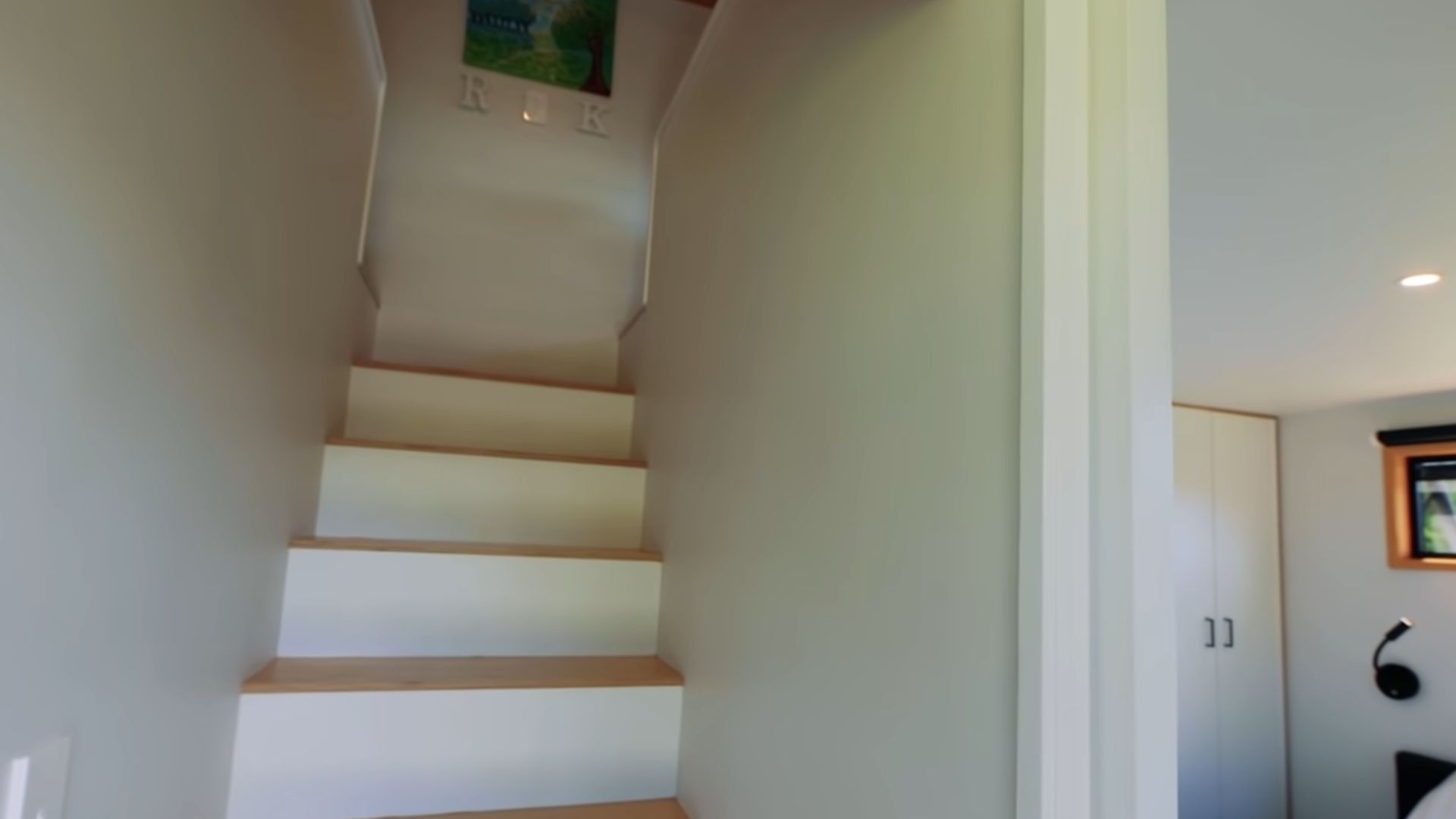 stairs with hidden drawers that lead upstairs