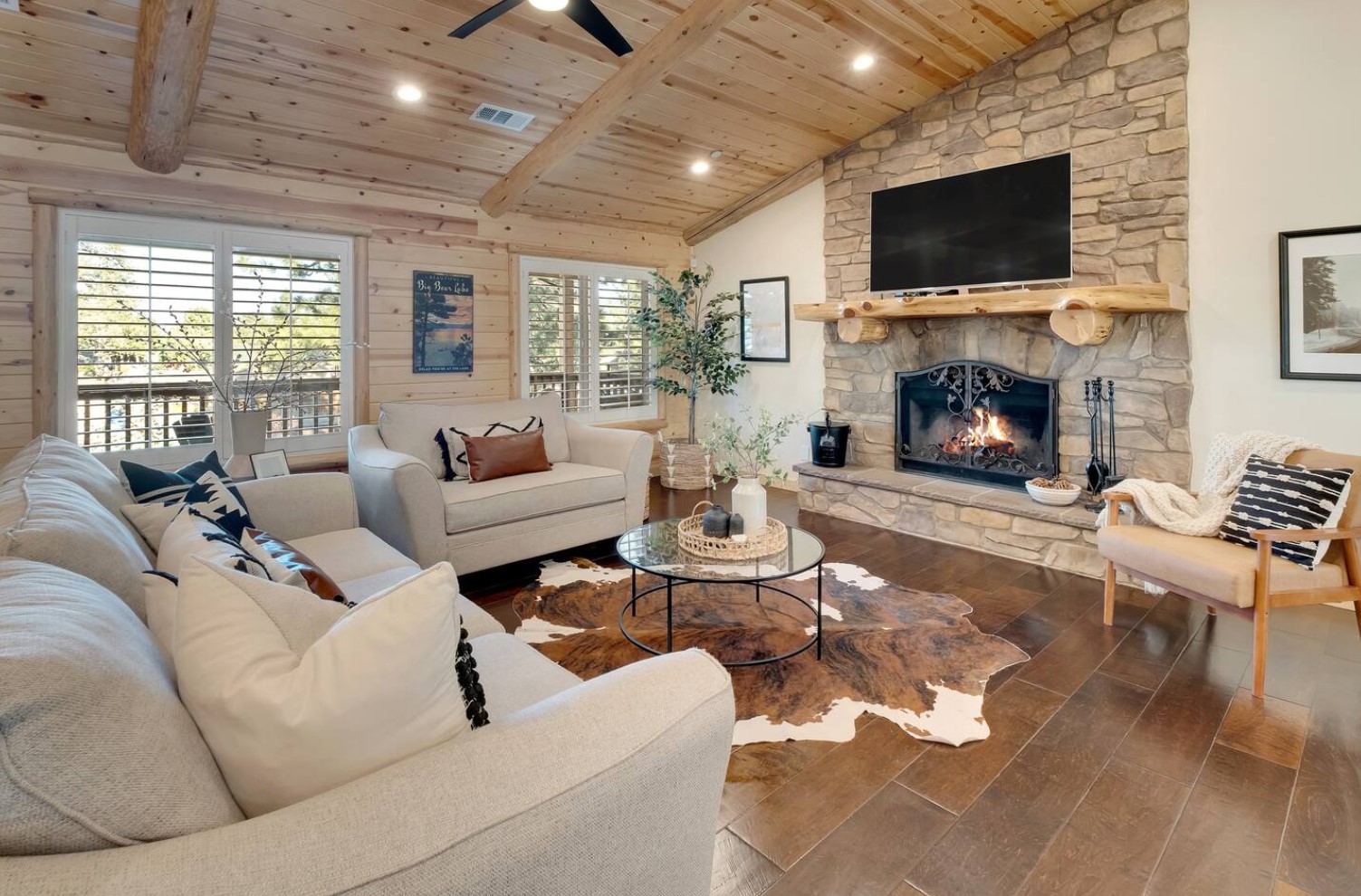 White living room with fireplace and TV