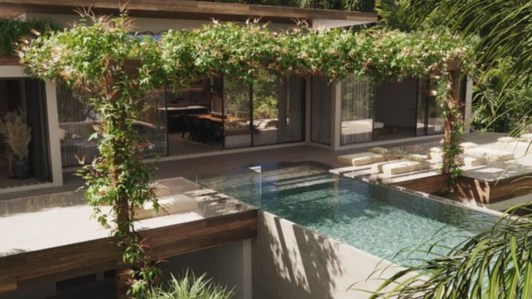 exterior of a modern house surrounded by greenery with a pool