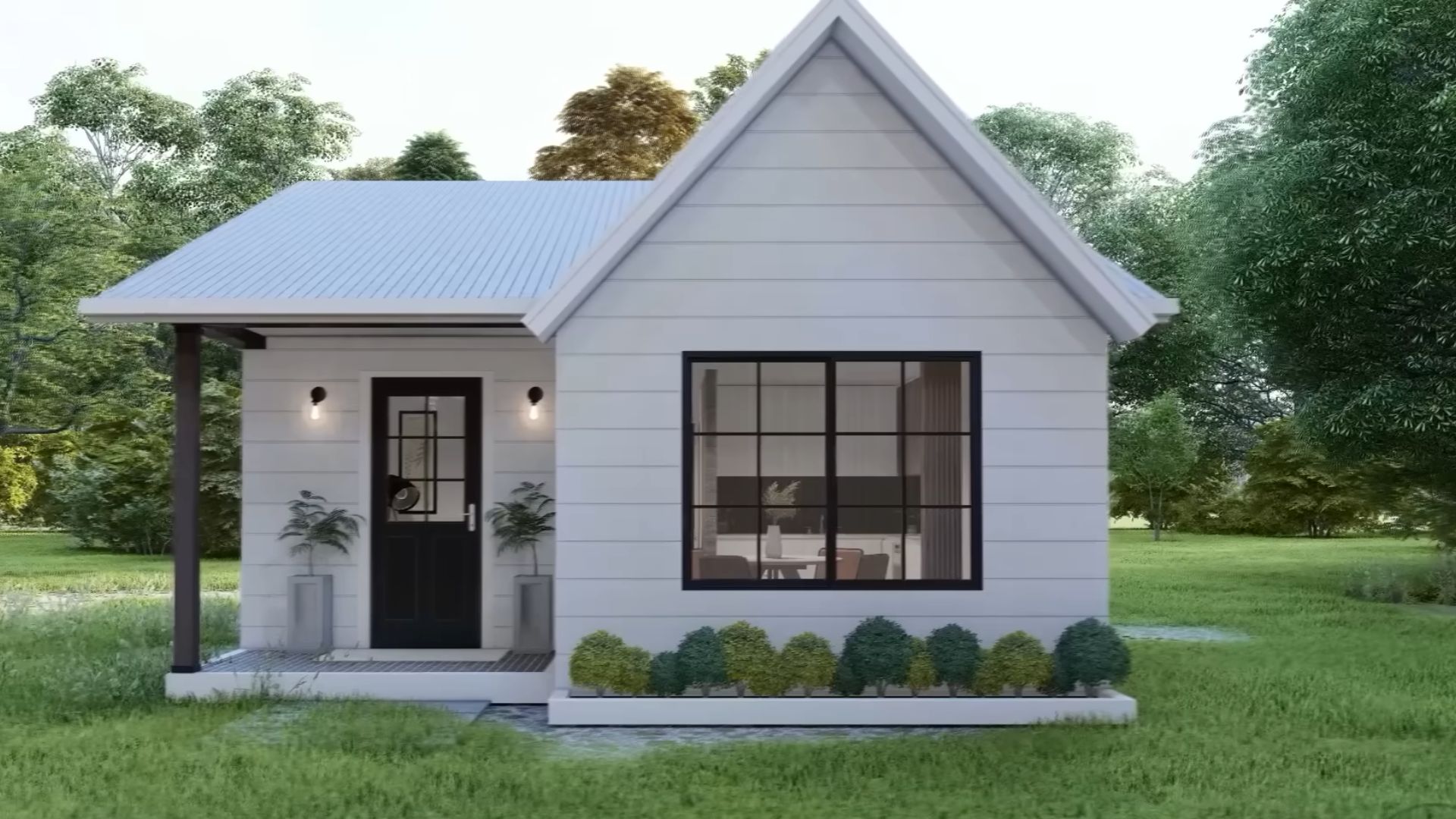 tiny house with white facade and white roof, black window and front door, surrounded by greenery