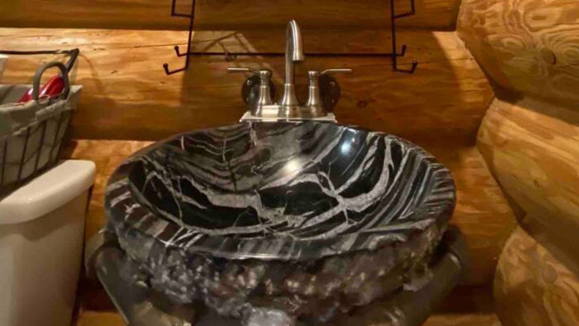 unusual black sink in the bathroom