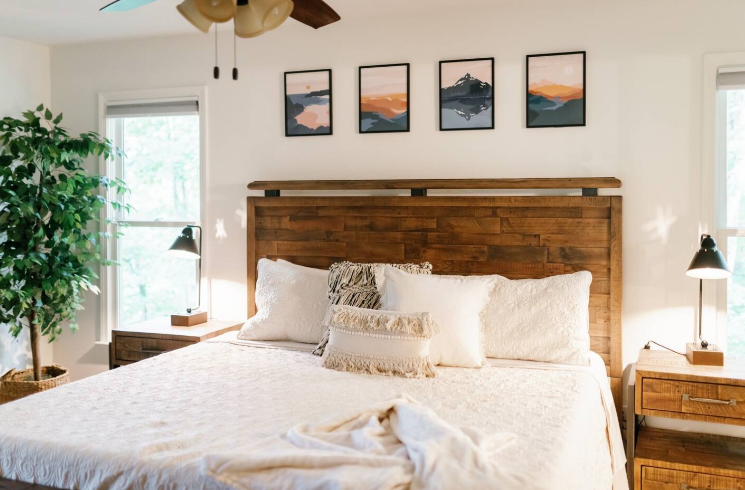 Bedroom with art, plants and wooden details