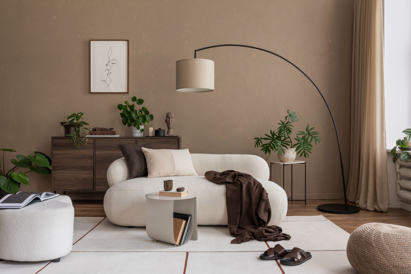 Beige living room with a withe couch and brown details