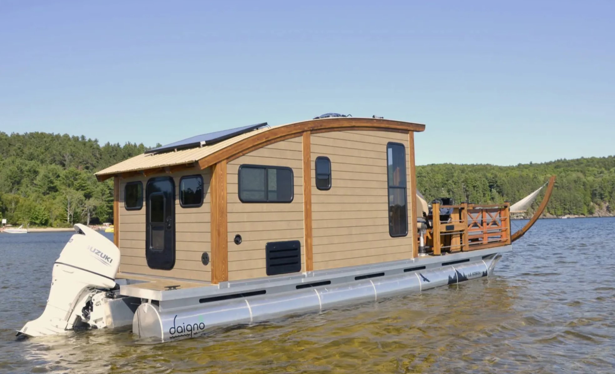 Tiny wooden boat house on water