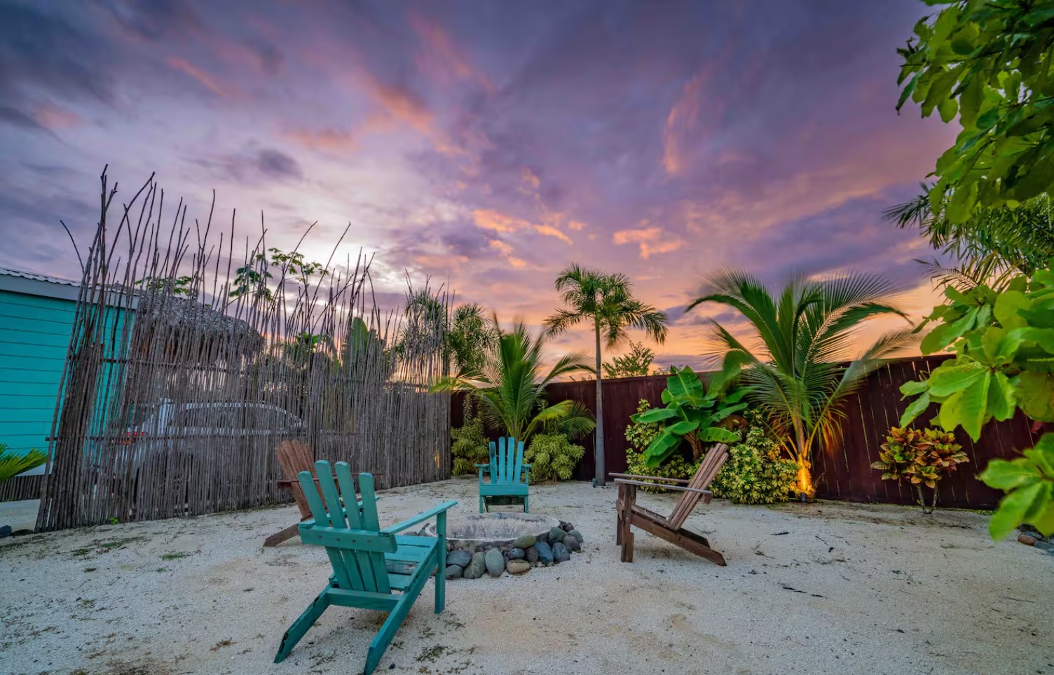 Fireplace on beach with four chairs