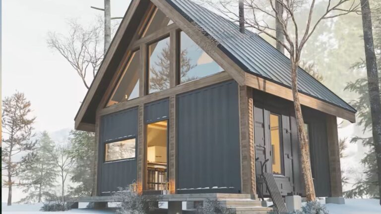 exterior of a container house in the woods surrounded by snow