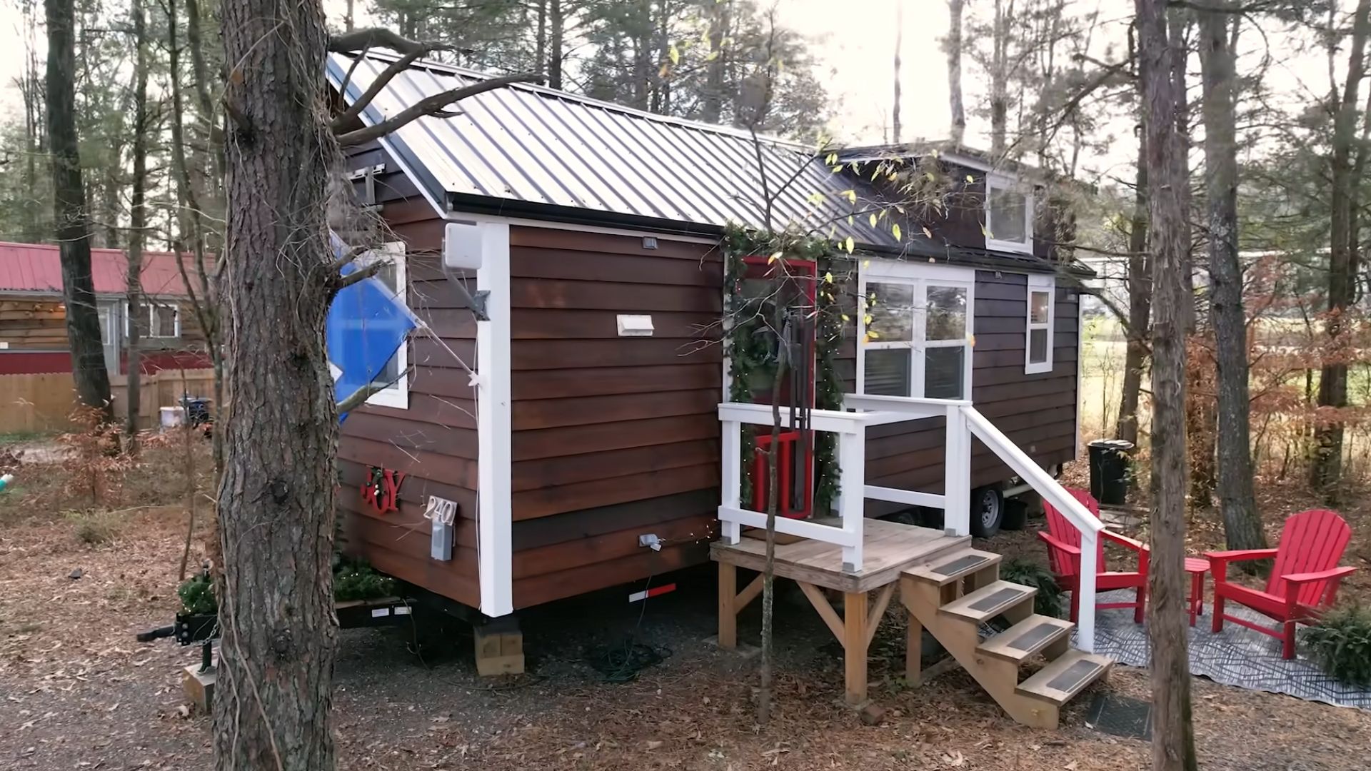 brown tiny house with red door