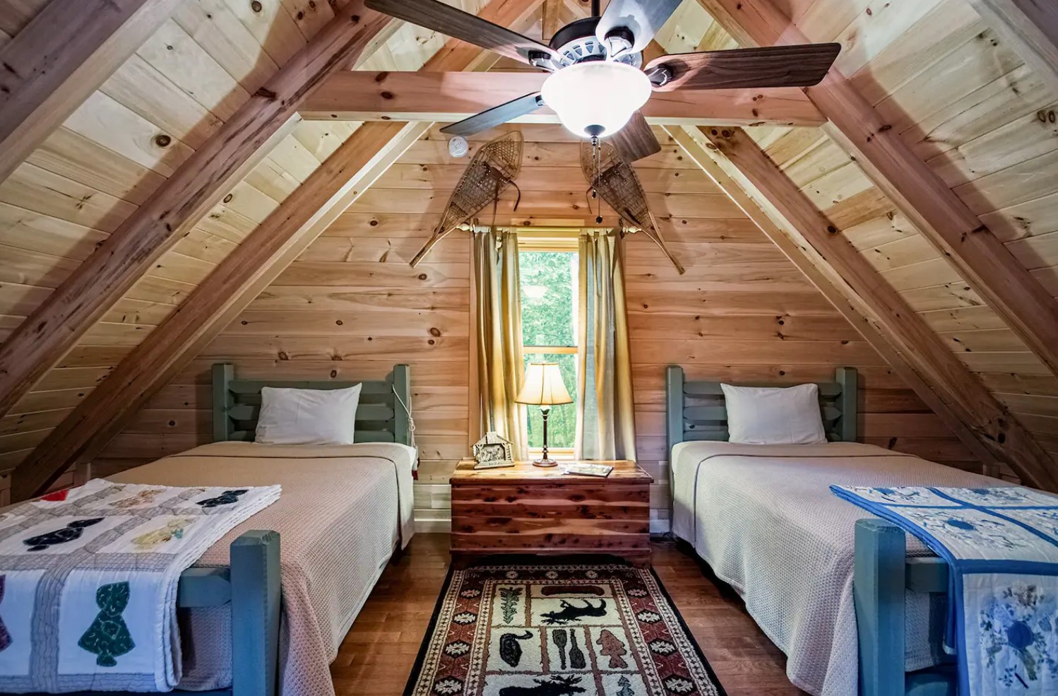 Loft bedroom with two beds and rustic decoration