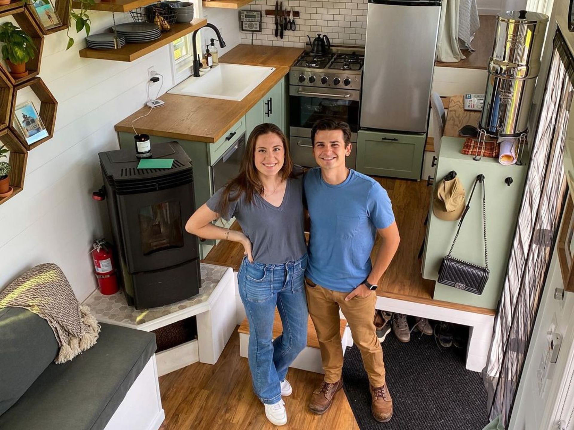 happy couple posing in their tiny home