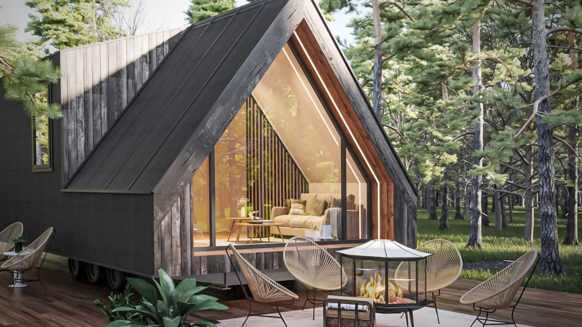 exterior of an a-frame tiny home with chairs in front surrounding a fire pit