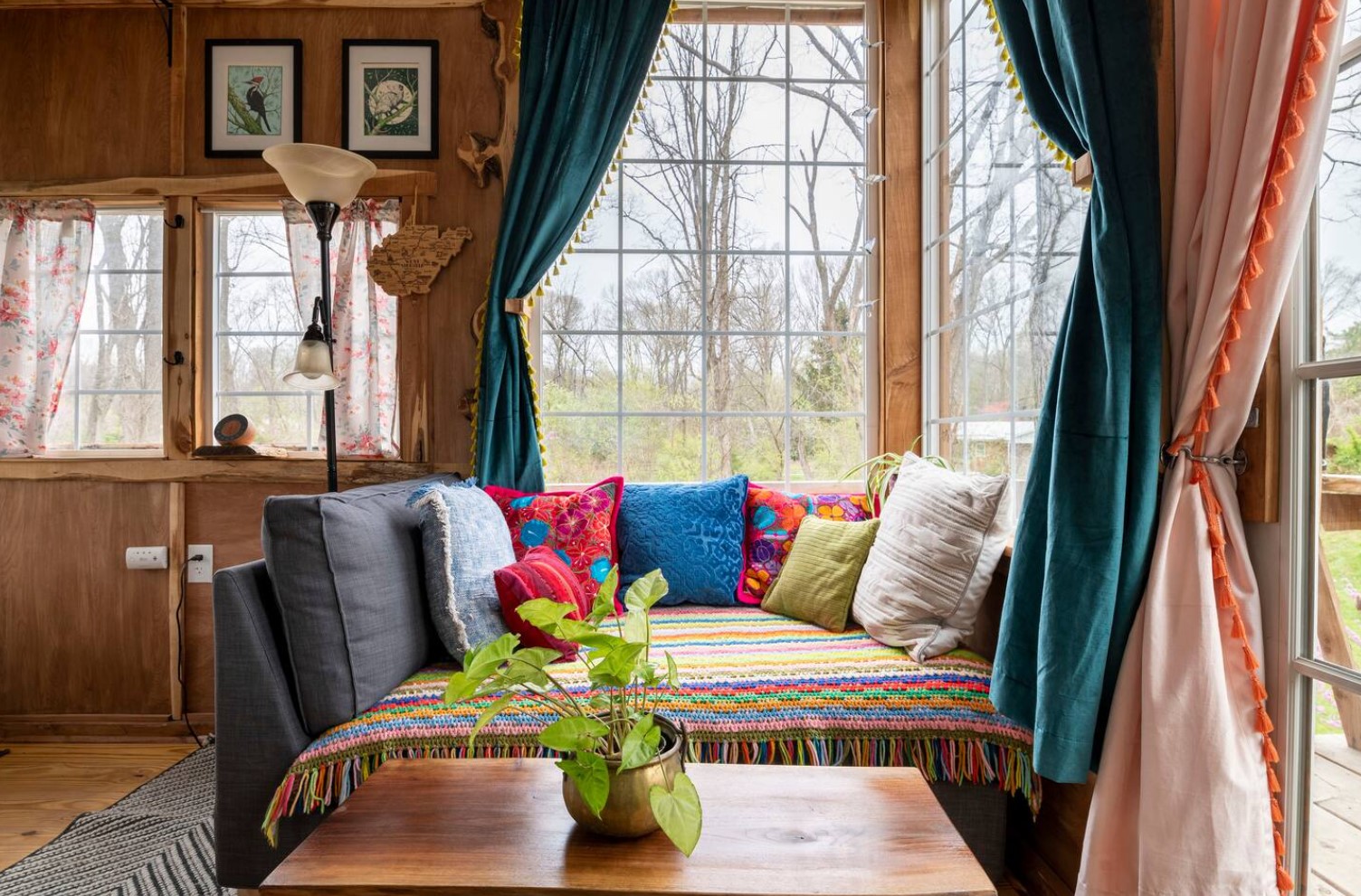 Small living room in a corner with colorful pillows