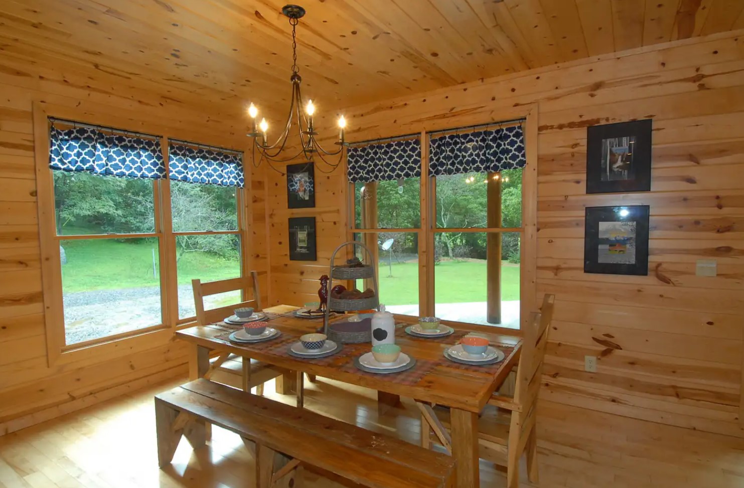 Spacious wooden dining room with windows