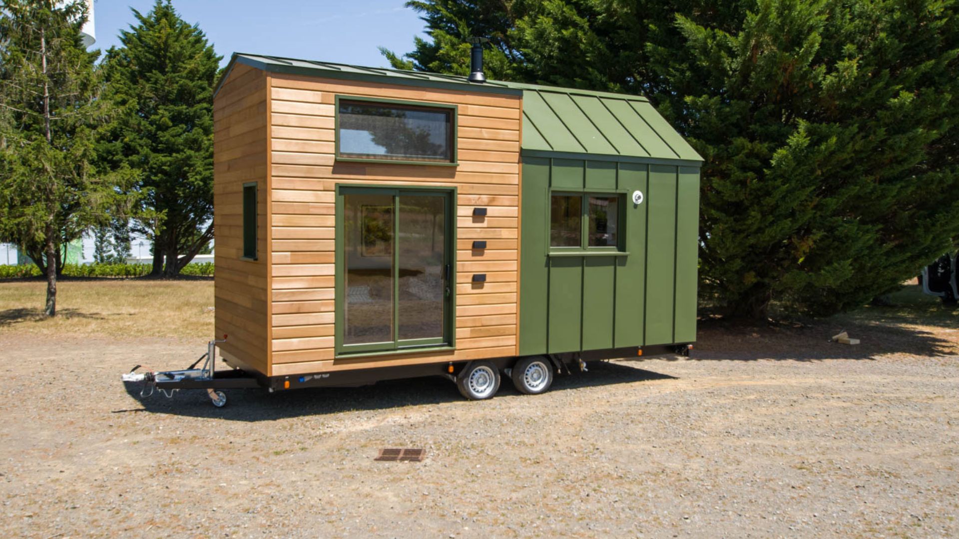 exterior of a green and brown tiny home