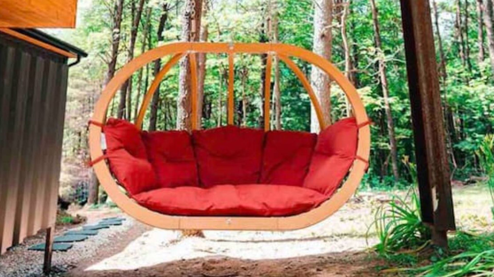 beautiful bed swing in oval shape with red cushion