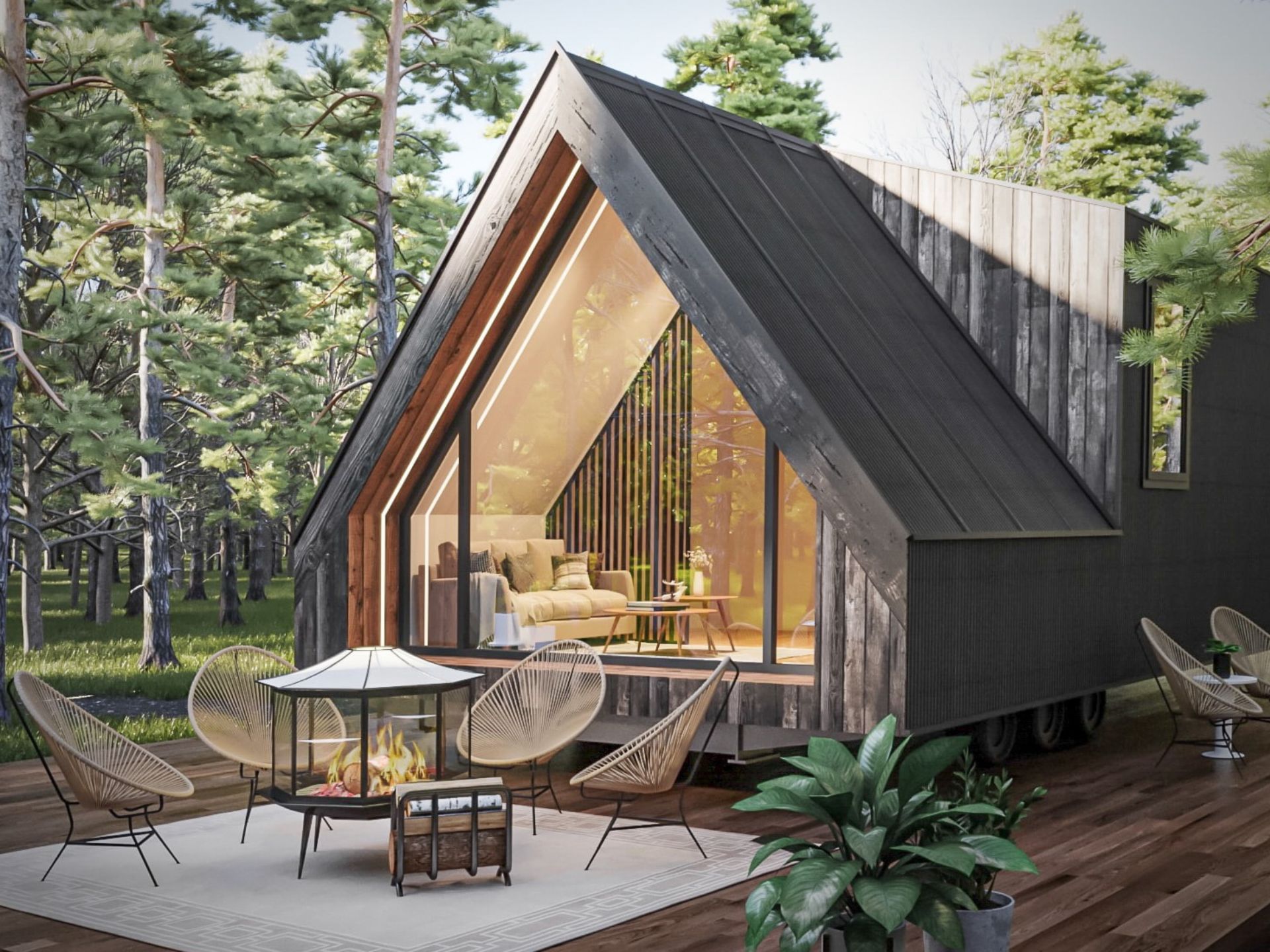 exterior of an a-frame tiny home with chairs in front surrounding a fire pit