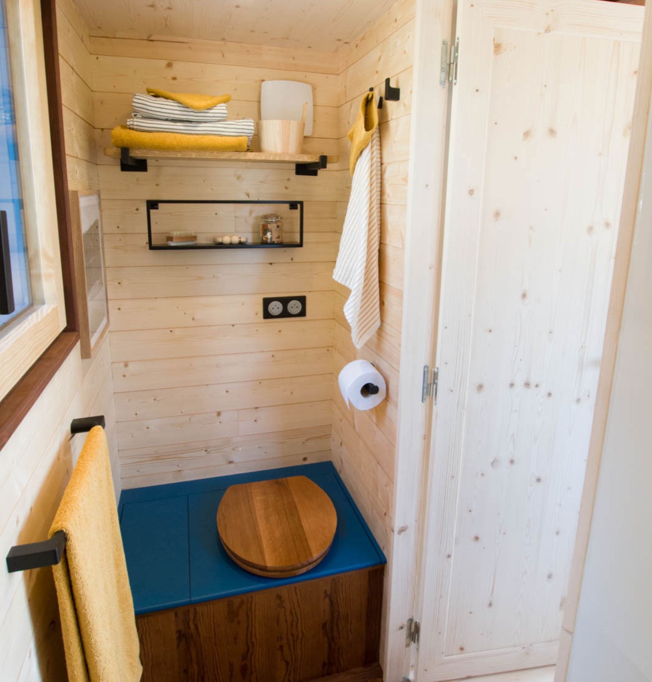 Tiny blue bathroom with decorations