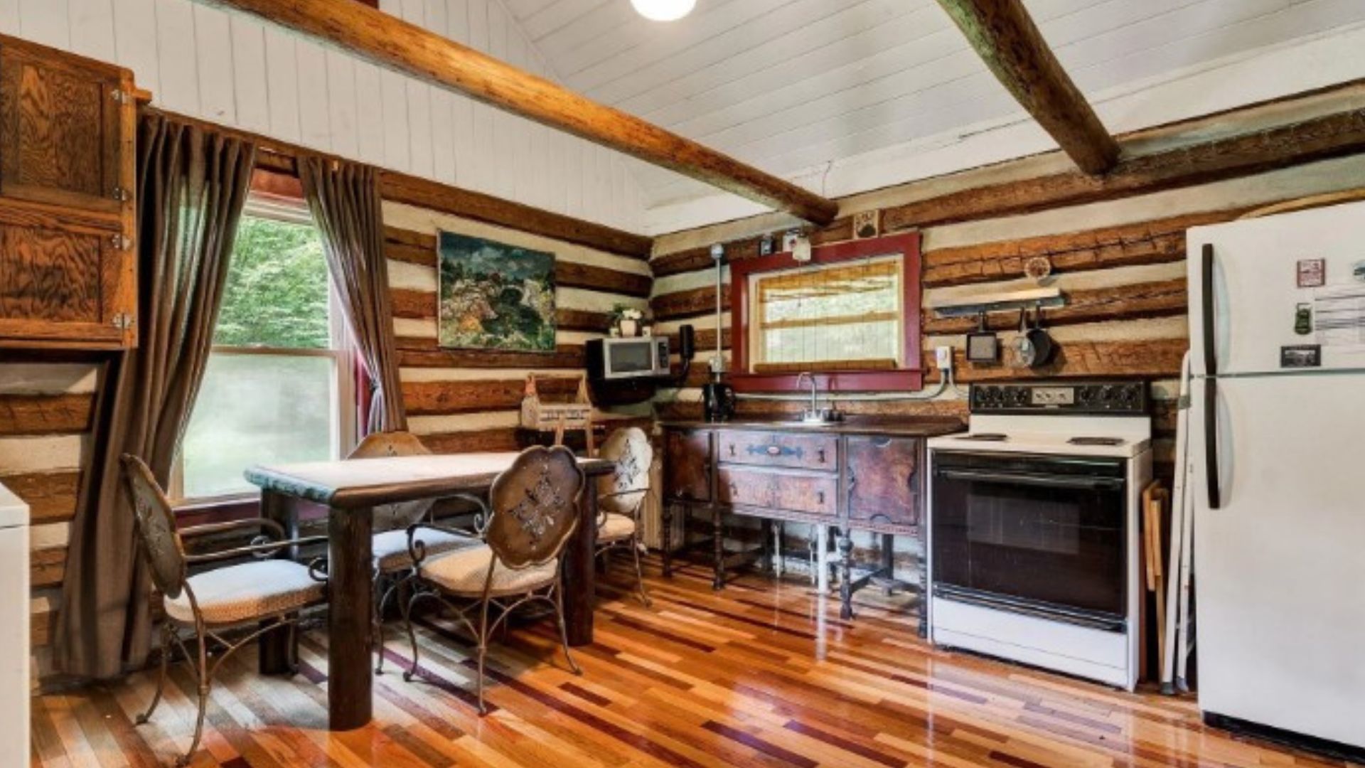 interior of an old cabin with classic furniture and a bit of rustic elements