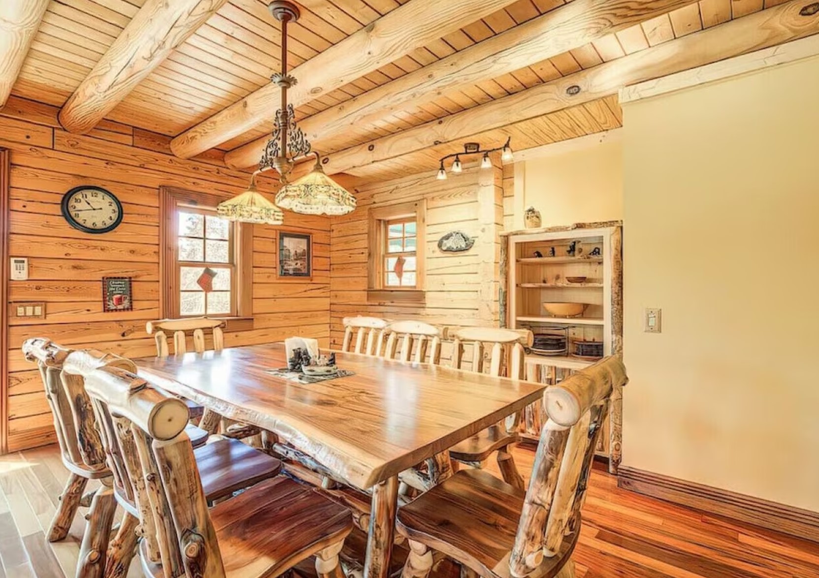 light wooden kitchen with rustic styled chairs