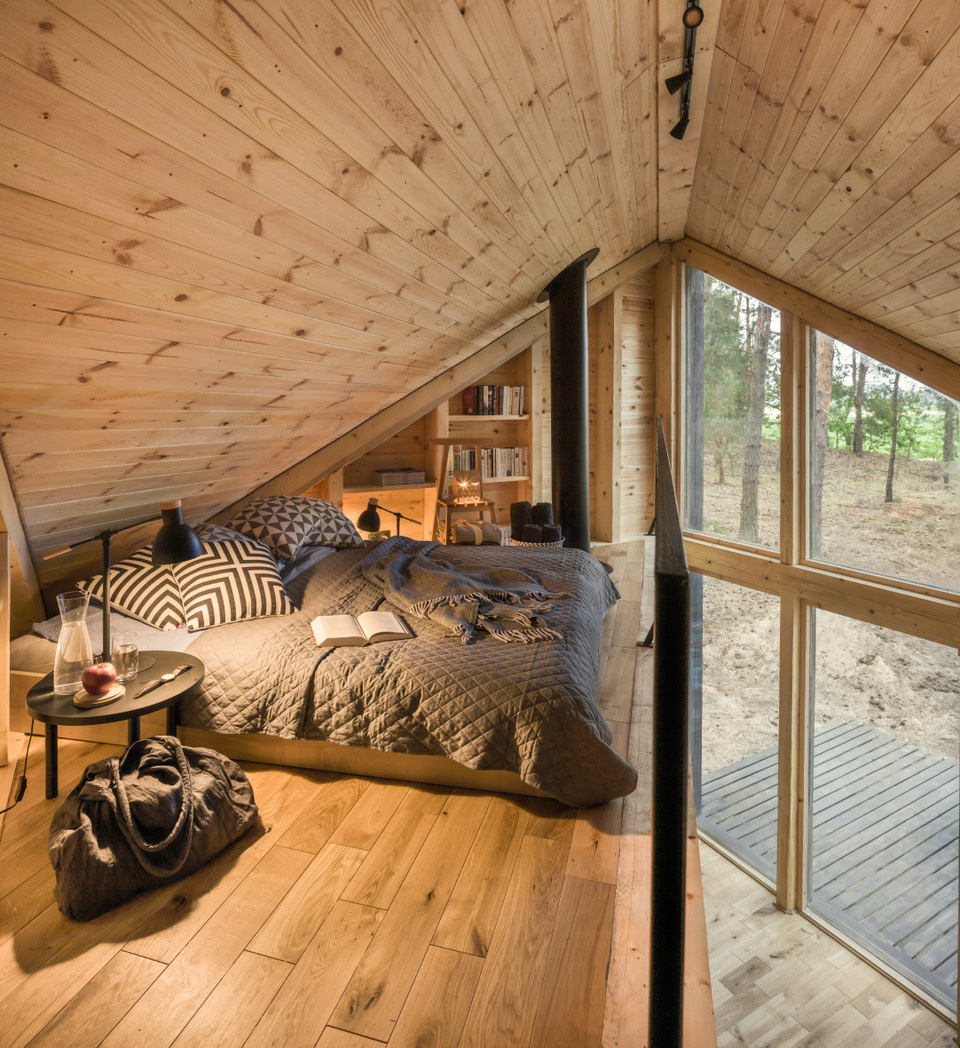 Wooden loft bedroom with a queen-sized bed