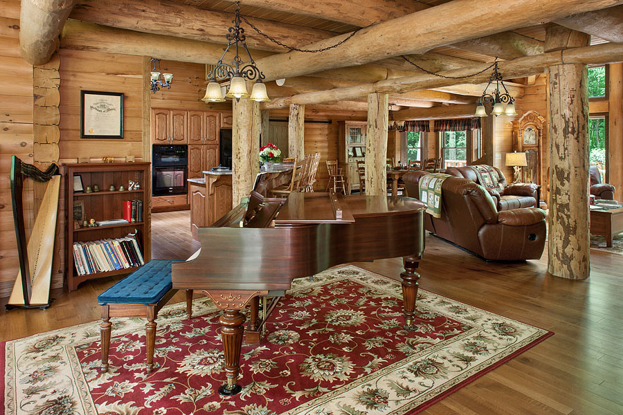 a brown piano and a harp in a living room, patterned carpet