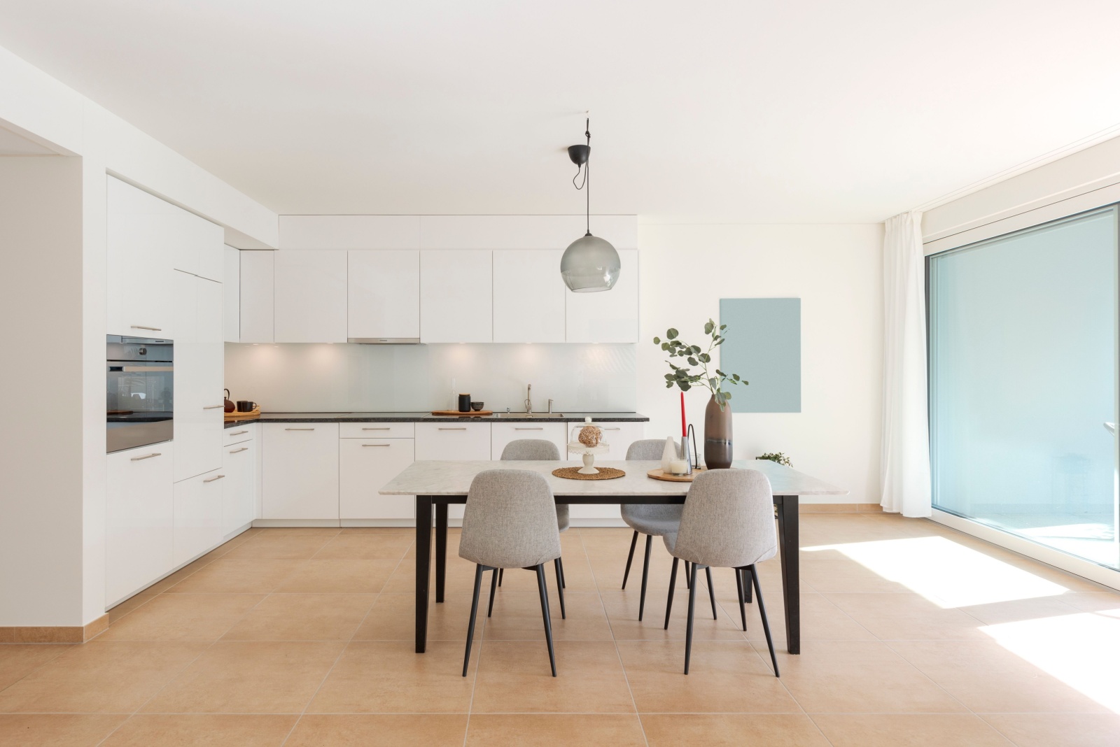 all white kitchen with white cabinets, white walls