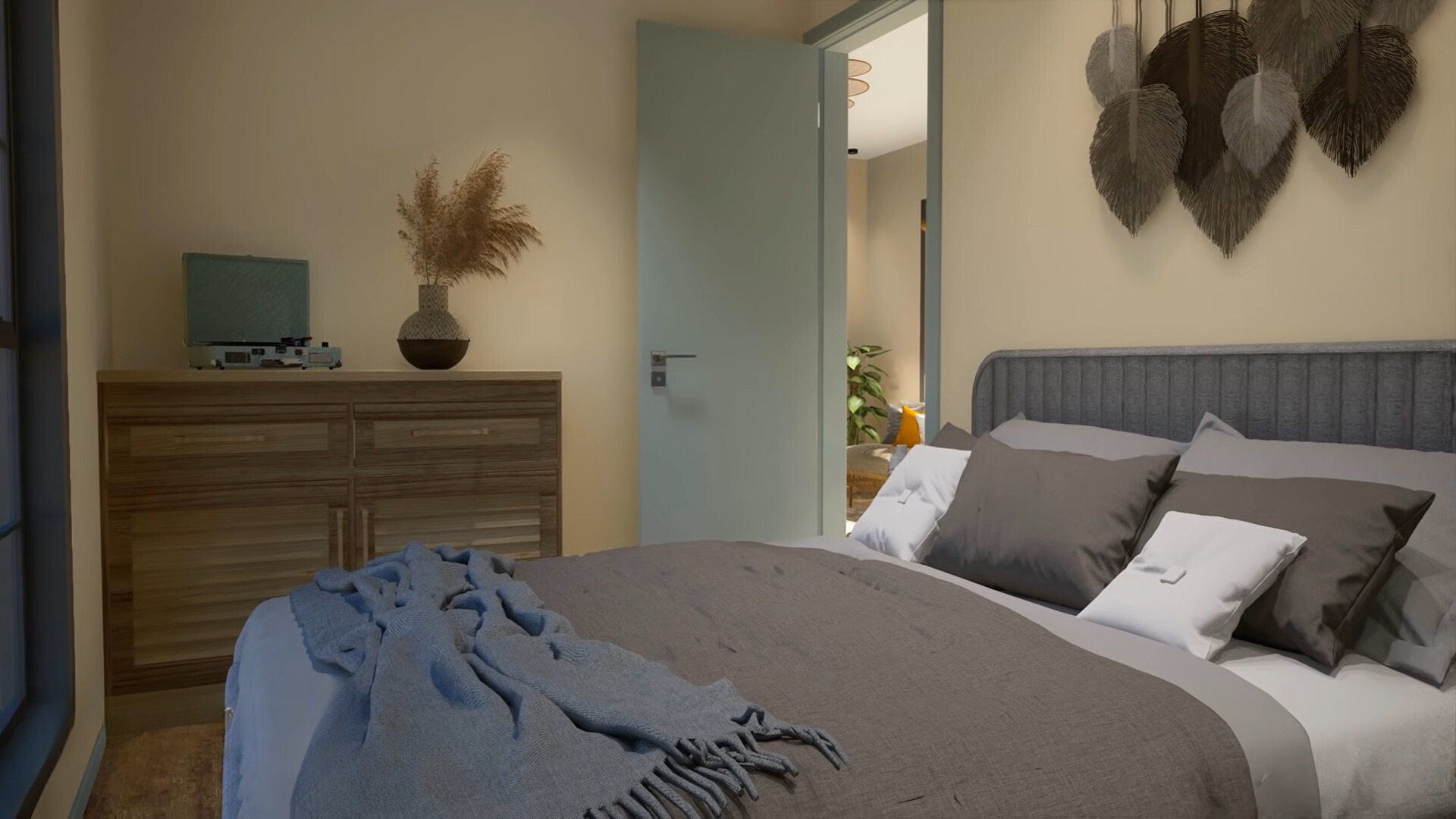 bedroom with a big bed, brown cabinet, vinyl player on top of it