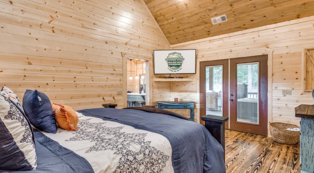 bedroom with a king-sized bed, flat screen tv in the corner