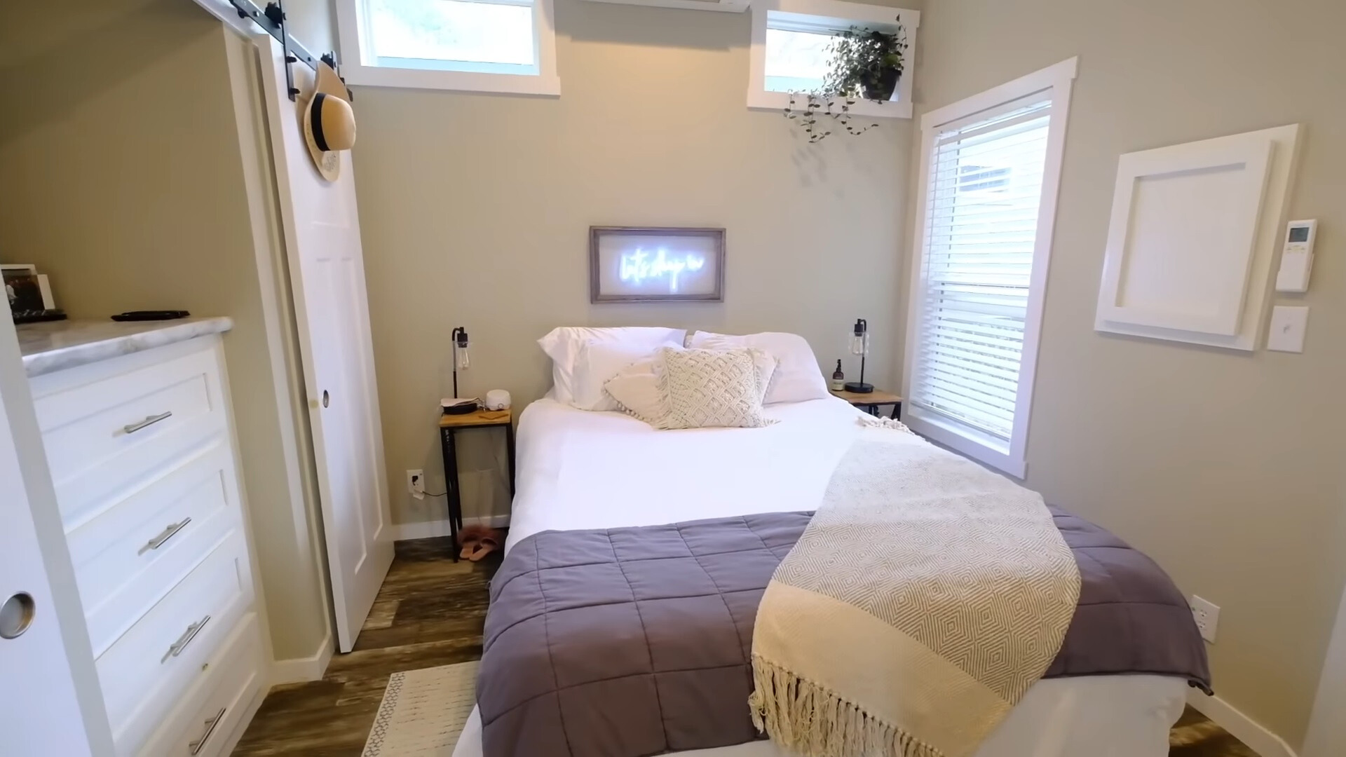 bedroom with a big bed, window right next to the bed