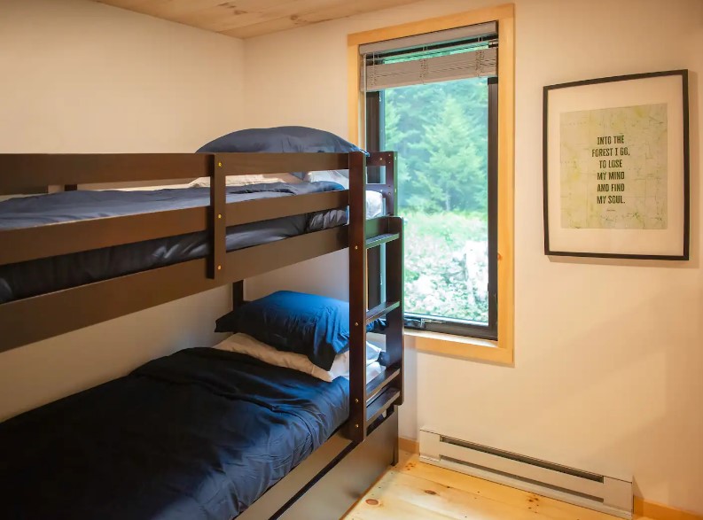 bedroom with bunk beds and a big window