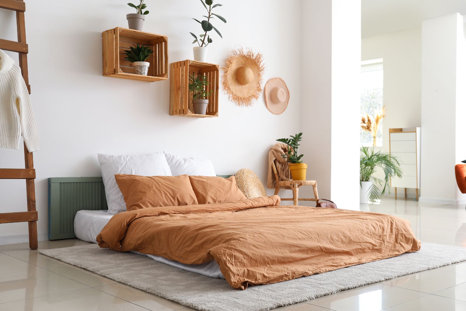 Bedroom with an orange bed and plants