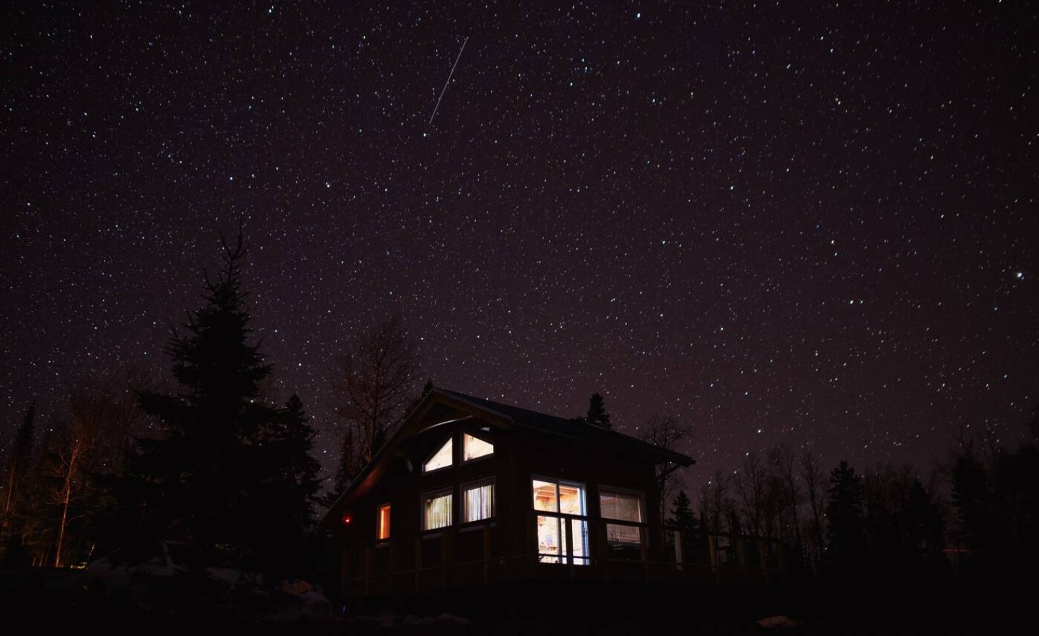 Tiny wooden cabin under the stars