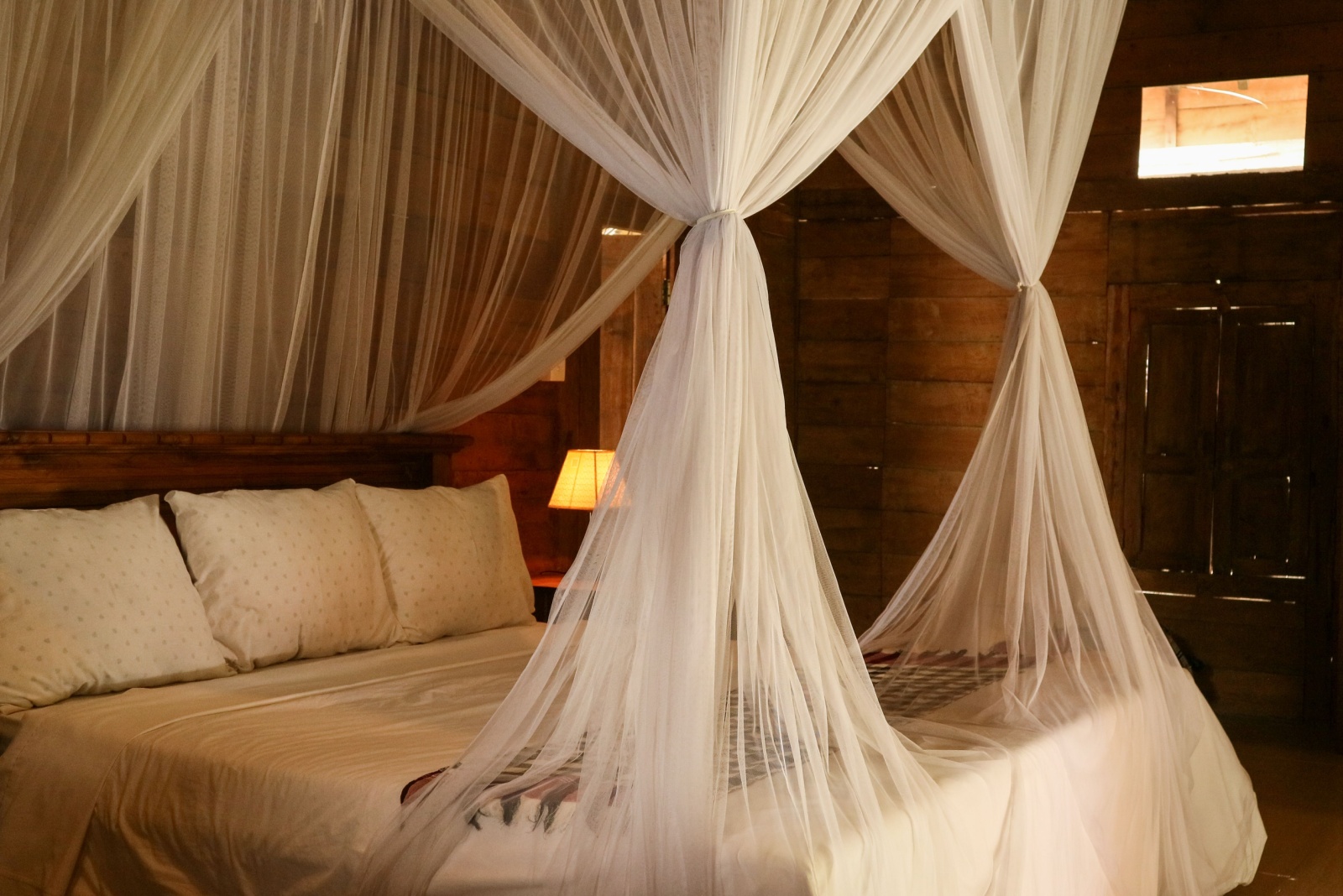 canopy bed with flowy curtains