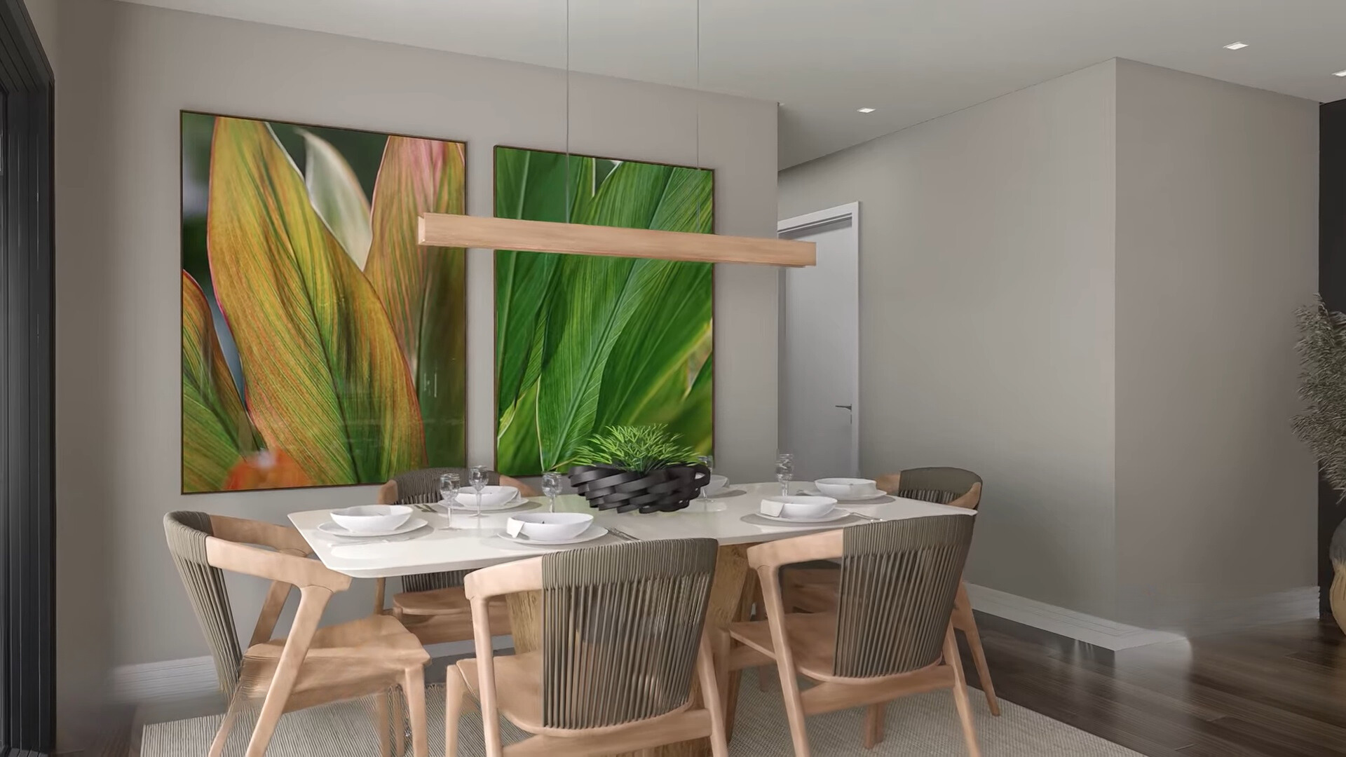 dining room with a white dining table surrounded by brown chairs and big, framed plant photos on the wal