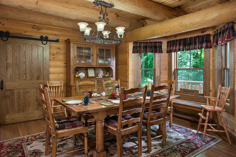 dining room with a brown dining table surrounded by brown chairs and a brown cabinet