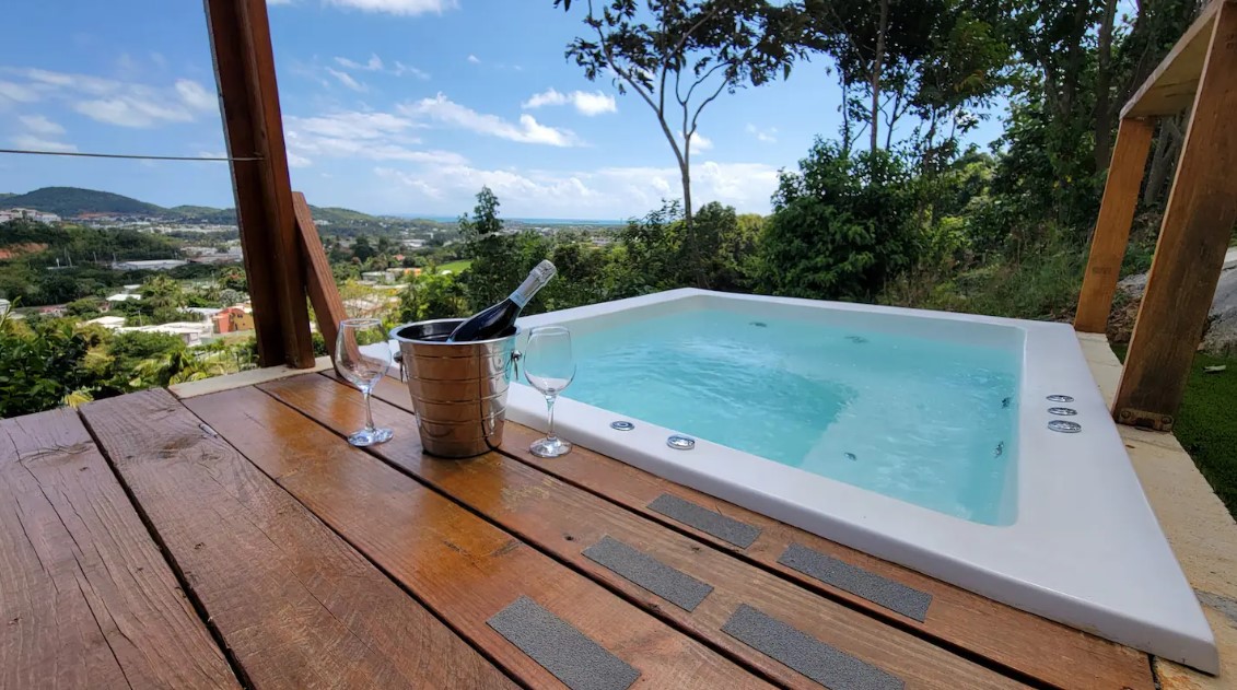 hot tub on the deck of a container