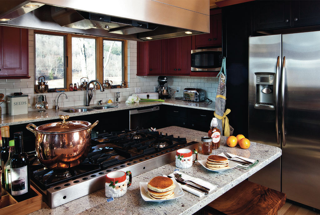 kitchen with an island, brown cabinets and an l-shaped countertop