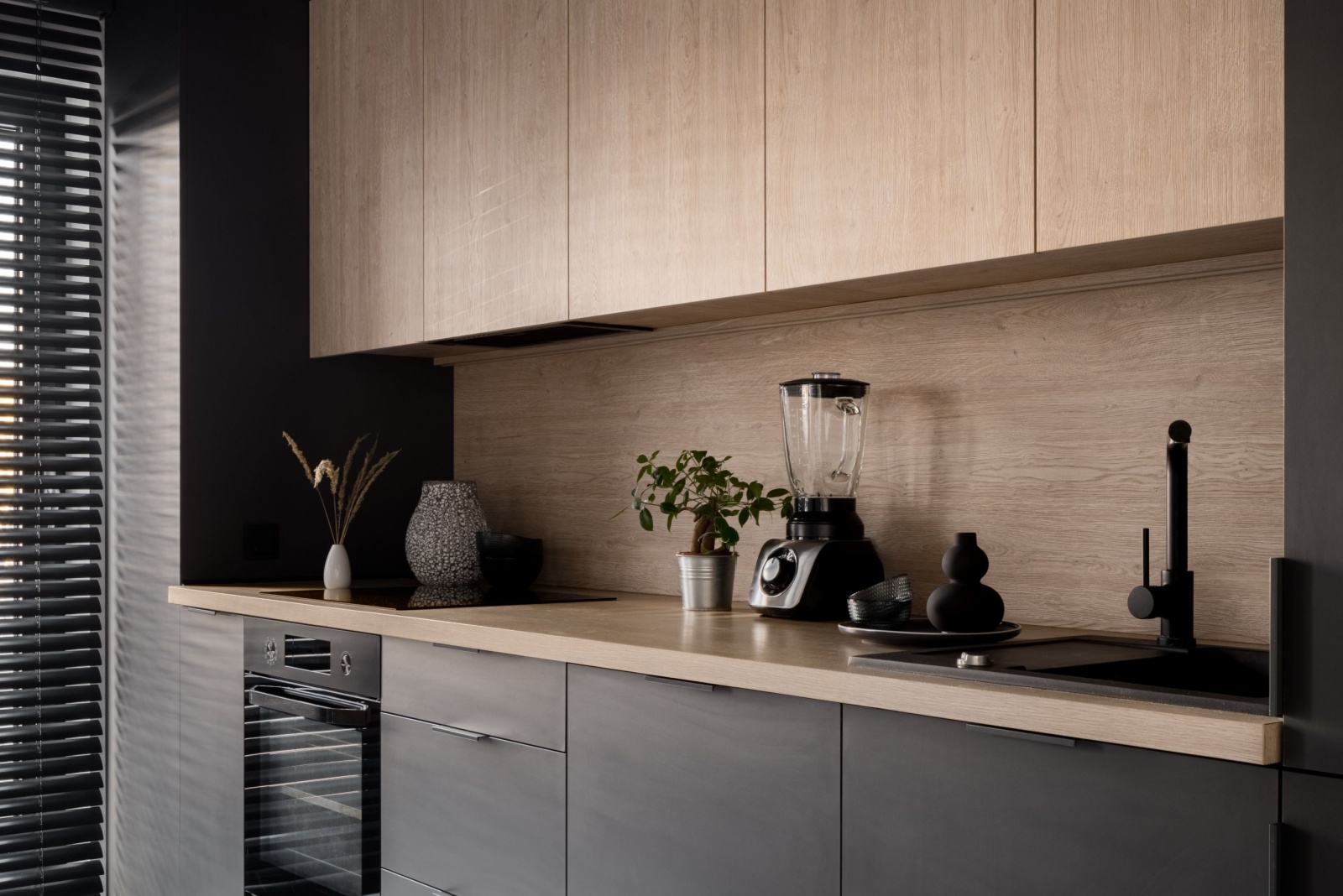 kitchen with black cabinets and wooden cabinets and wooden countertop