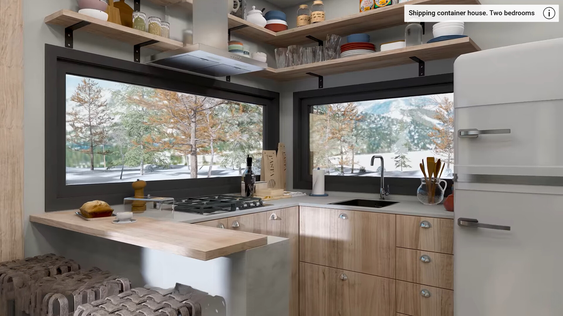 kitchen with two windows under the light brown shelves, three bar stools at the countertop, gray countertop with one higher positioned brown countertop