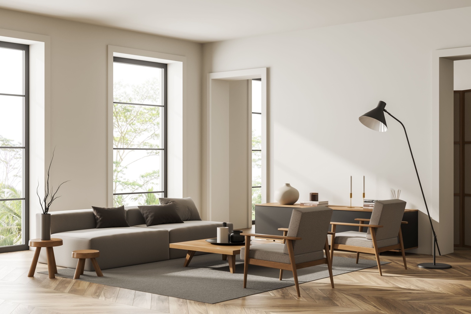 living room with big windows, a big lamp, gray couch facing two chairs and a brown table