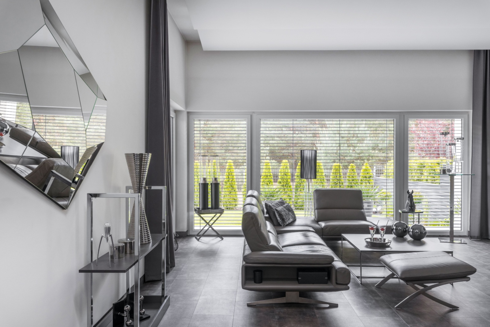 living room with dark gray and leather couch, sofa and table, dark gray shelves