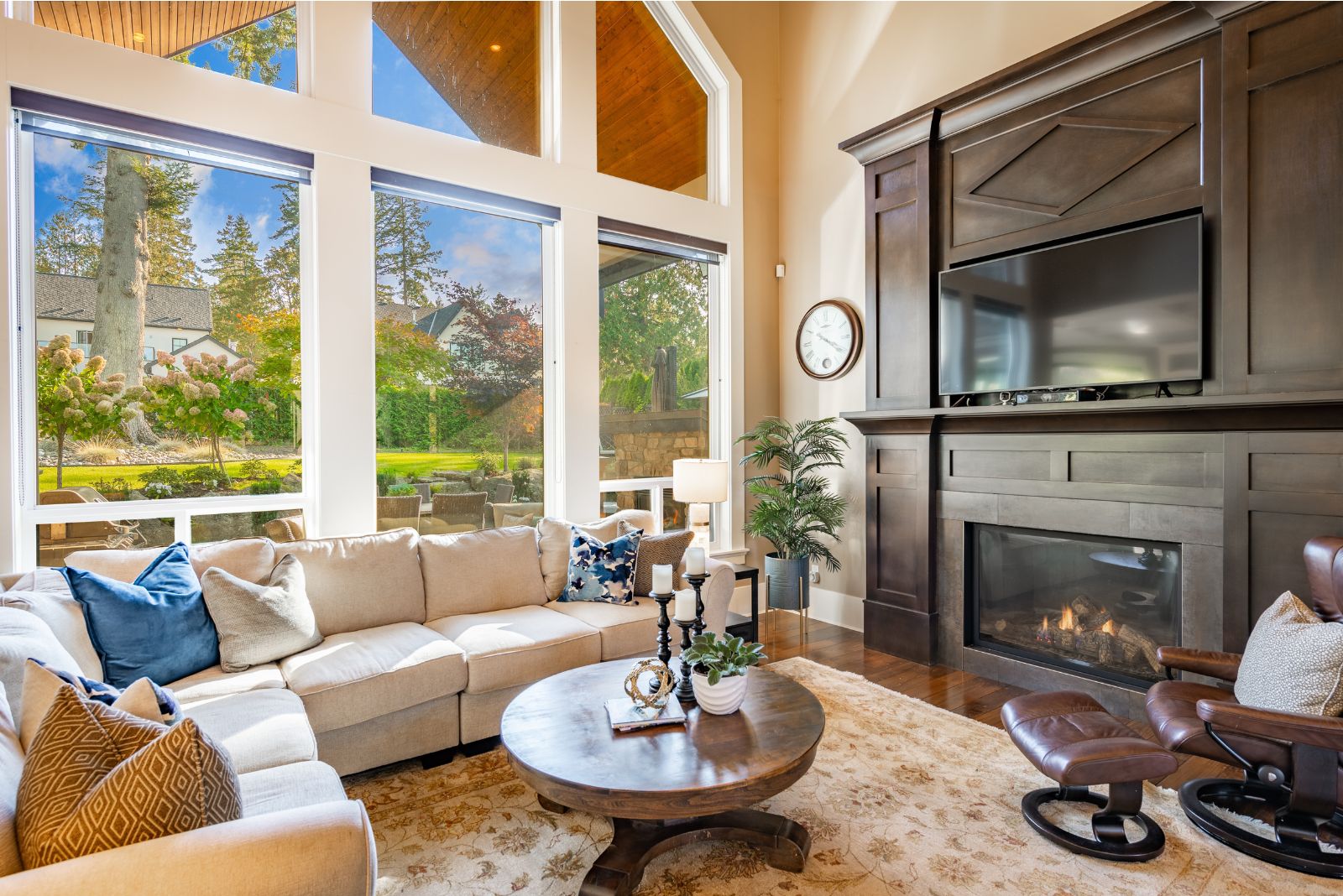 Modern living room with glass wall and a wooden fireplace