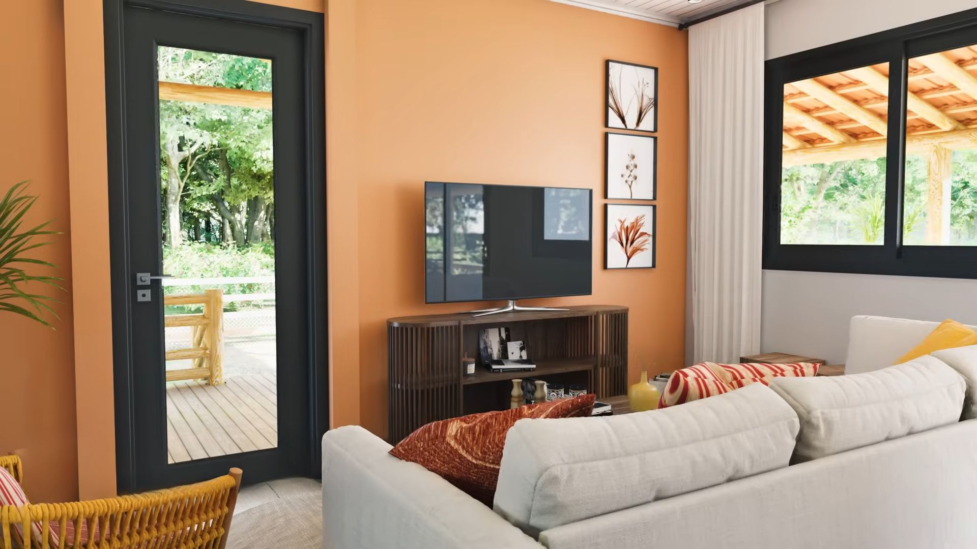 Orange living room with a white couch and a TV