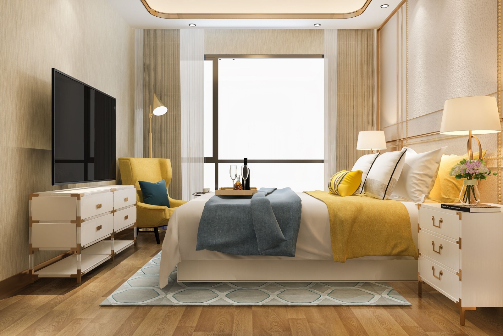 bedroom with an cream colored wall, white bedside table cabinet, flat-screen tv, yellow chair in the corner, yellow pillow and a yellow blanket