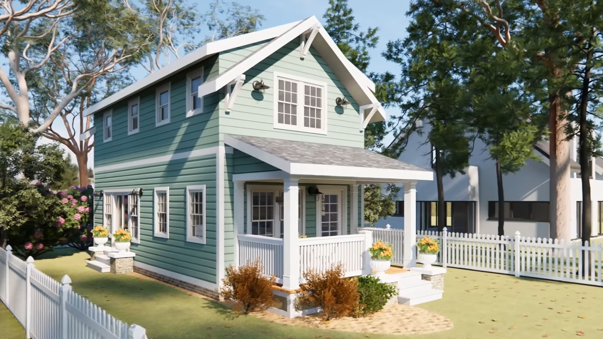 exterior of the two-story house with gree siding, white windows and white trim, a front porch and a lovely yard around it