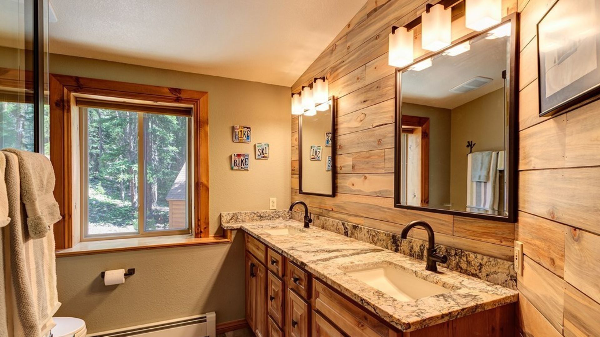 beautiful bathroomw uth double vanity and lo walls